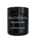 Black balm jar with herb-infused tallow ingredients label on white background.